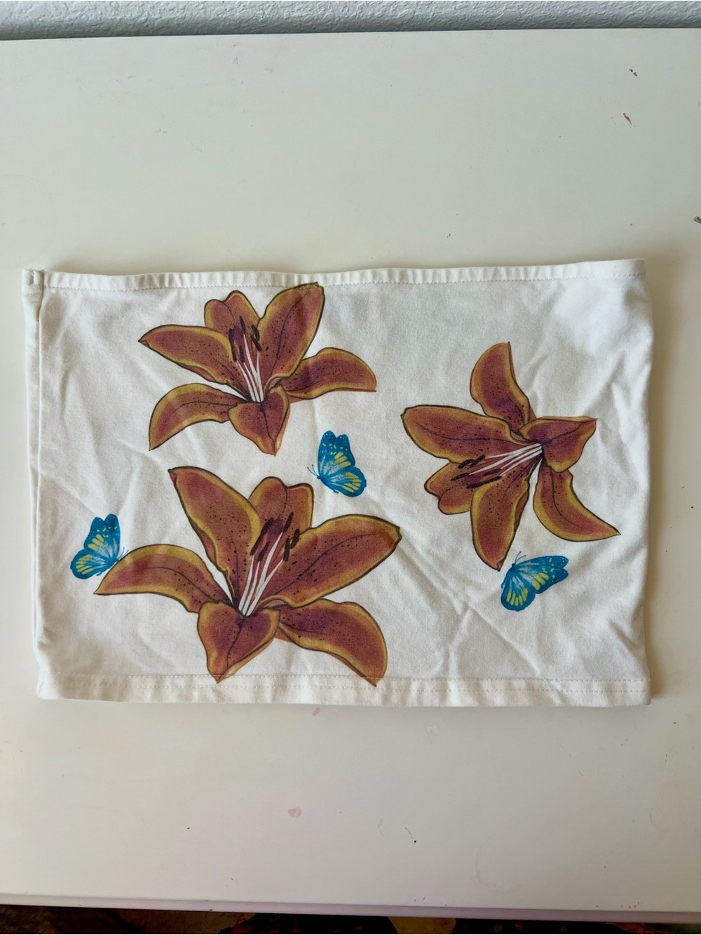 Edikted White Hand Towel with Brown Lilies and Blue Butterflies